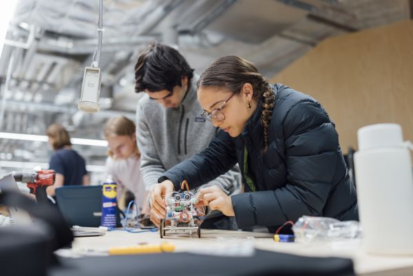 Students working on a small mechanical project